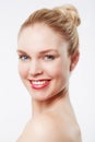 Looking radiant in red lipstick. Portrait of a beautiful blonde woman smiling at the camera. Royalty Free Stock Photo