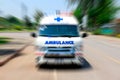 Ambulance speeding to accident, Emergency ambulance travels through city street zoom effect.