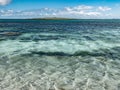 Distant view of the Holm of Papay seen from the shore of Papa Westray, Orkney