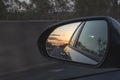 Looking through a side mirrors with a car in it Royalty Free Stock Photo
