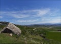 Looking south amongst the rolling hills and high mountains of the Andalucian region in Spain.