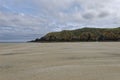 Looking South to the headland on one end of Garry Beach on the Isle of Lewis on a cloudy day in June Royalty Free Stock Photo