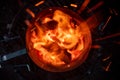 Looking down into the burning charcoal of a Chimney Starter on a backyard grill Royalty Free Stock Photo