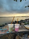 looking at the sunset while enjoying the sweetness of pop ice and the breeze