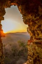 Looking at sunset through medieval castle window at Vrdnicka kula, Fruska Gora, Serbia Royalty Free Stock Photo
