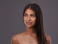 Looking to the future of beauty. A young woman with sleek hair posing in studio.