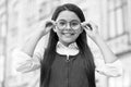 Looking to future. Happy kid fix eyeglasses outdoors. Eye sight development. Child vision. Back to school eye sight test Royalty Free Stock Photo