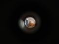 Looking to the hall in a house via peephole.