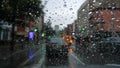 Looking at traffic through a windshield covered with raindrops, on a dreary and gloomy day Royalty Free Stock Photo