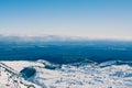 Looking from Turoa down over Tongariro National Park, higher grounds covered with snow. Beautiful winter day at Mountain