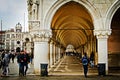 Looking under the arches of the Palazzo Ducale at the San Marco Square in Venice. (Venice, Italy - 20/03/2017 Royalty Free Stock Photo