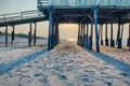 Looking under pier towards sandy beach at avon north carolina Royalty Free Stock Photo