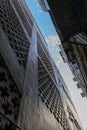 Looking up the alleyway at noon between two old buildings in Mongkok, Hong Kong.