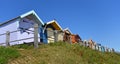 Looking up at Beach huts on a sunny ay blue sky background. Royalty Free Stock Photo
