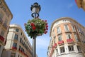 Beautiful buildings from the main shopping streets in the city; Calle Larios and Calle Nueva, Malaga, Andalusia, Spain.