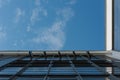 Looking up at big window front with partially opened windows of the Bauhaus in Dessau on clear day