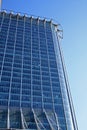 Looking up at blue glass reflective office