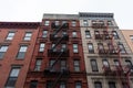 Colorful Old Buildings on the Lower East Side of New York City with Fire Escapes Royalty Free Stock Photo
