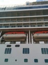 Looking up at cruise ship with life boats