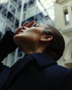 Looking up, Female portrait with city architecture