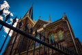 Looking up at a fence and St. Peter's Roman Catholic Church, in Royalty Free Stock Photo