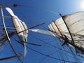 Looking up at the full sails of a traditional tallship at sea