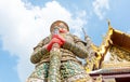 Looking up at giant statue at Grand palace, Temple of the Emeral