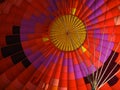 Looking up into the interior of a red yellow purple hot air balloon Royalty Free Stock Photo