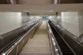 Looking up a long concrete stairs with an escalator on each side Royalty Free Stock Photo