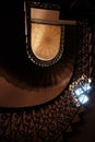 Looking up low angle abstract view of old dark stairway staircase in run-down apartment building in Lviv, Ukraine