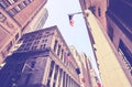 Looking up at Manhattan buildings at the Wall Street, color toning applied, New York City, USA Royalty Free Stock Photo