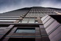 Looking up at a modern building under a cloudy sky in Philadelphia, Pennsylvania. Royalty Free Stock Photo