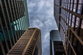 Looking up at modern buildings and a stormy sky in Philadelphia, Pennsylvania. Royalty Free Stock Photo