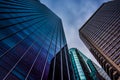 Looking up at modern buildings under a cloudy sky in Philadelphia, Pennsylvania. Royalty Free Stock Photo