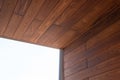 Looking up at a modern luxury house detail of thermo wood cladding Royalty Free Stock Photo