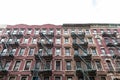 Old Colorful Brick Apartment Buildings in Greenwich Village of New York City with Fire Escapes Royalty Free Stock Photo