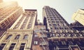 Looking up at old Manhattan buildings against the sun, color toned picture, New York City, USA Royalty Free Stock Photo