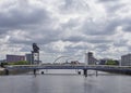 Looking Up river from the Millennium Bridge on the River Clyde and the various Hotels and Entertainment Facilities.