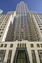 Looking up at Rockefeller Center, New York City, New York with American Flag Royalty Free Stock Photo