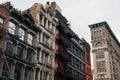 Row of Colorful Old Buildings in SoHo of New York City with Fire Escapes Royalty Free Stock Photo