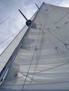 Looking up at sails and mast of boat yachting Royalty Free Stock Photo