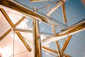 Looking up at the sky through an abstract chrome statue at the Frederik Meijer Gardens