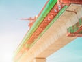 Looking up sky train construction site during railroad track installation in downtown with blue sky. Royalty Free Stock Photo