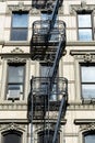Small Black Fire Escapes on an Old White Stone Building on the Lower East Side of New York City Royalty Free Stock Photo