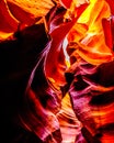 Looking up at the smooth curved Red Navajo Sandstone walls of the Upper Antelope Canyon