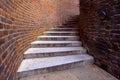 Looking up some winding street steps curving to the right Royalty Free Stock Photo