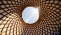 Looking up at the sun through a beautifully woven wooden structure in a tranquil setting Generative AI Royalty Free Stock Photo