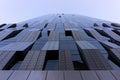 Looking up tall glass and steel high-rise building. Windows of hi-tech building. Abstract modern architecture. Geometric Royalty Free Stock Photo