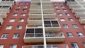 Looking up at a tall red stucco hotel Morton Plaza