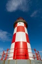 Looking up at Tall Red and White Lighthouse Royalty Free Stock Photo